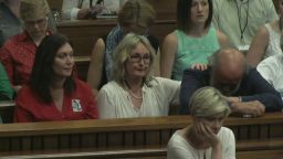 Reeva Steenkamp's parents listen to testimony from Reeva's cousin, Kim Martens on October 15, 2014 in Pretoria, South Africa.