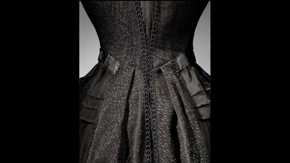 Almost all of the garments featured in the exhibition are black, understandably. "Black was fairly well established as the color of mourning by the late Middle Ages in Europe." 