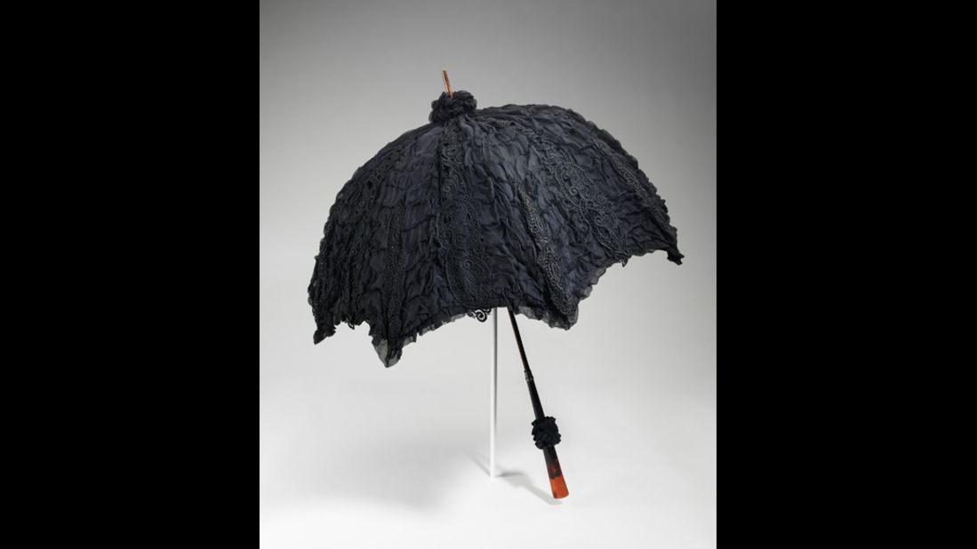 Mourning accessories, like this silk parasol, projected the same luxuriousness as the gowns. 