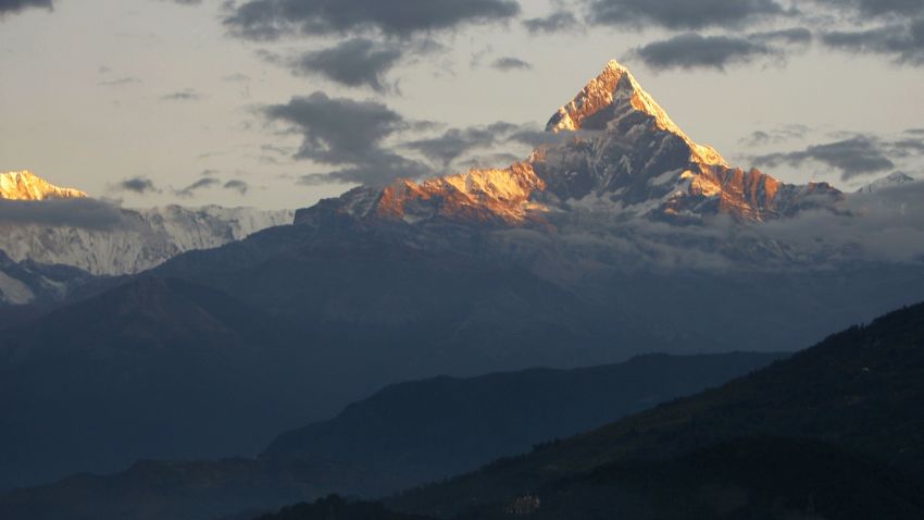(FILES) In this photograph taken on November 1, 2010, Mount Machhapuchhre, which stands at 6993 metres and forms part of the Annapurna region, is seen from Pokhara, some 200kms west of the Nepalese capital Kathmandu. A snowstorm and avalanche in Nepal's Himalayas has killed nine trekkers -- eight foreign and one local -- on a popular hiking circuit, while more than 100 others remain out of contact, officials said October 15. AFP PHOTO/Prakash MATHEMA/FILESPRAKASH MATHEMA/AFP/Getty Images
