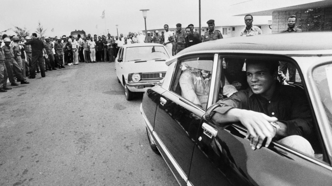 Ali passes a cheering crowd in Kinshasa, Zaire (now the Democratic Republic of Congo), on September 28, 1974. Ali was in the country to fight George Foreman, who had recently defeated Frazier to win the title.