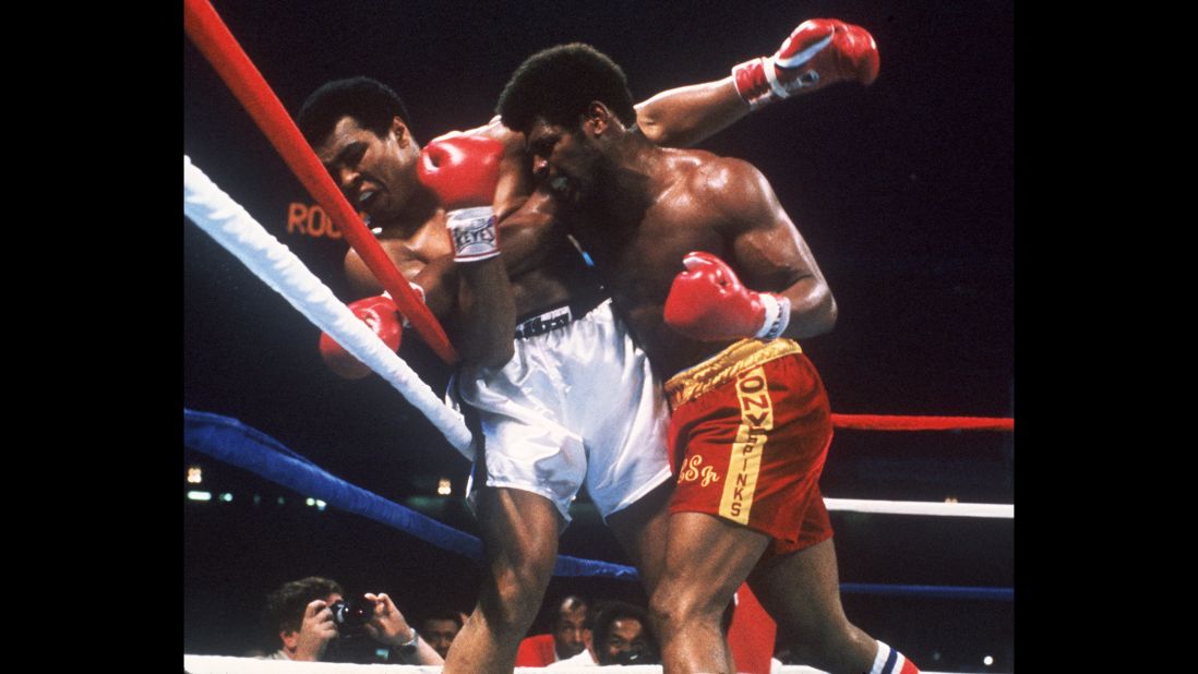 Ali takes a hit from Leon Spinks during their title fight in New Orleans on September 15, 1978. Ali won by unanimous decision, regaining the title he lost to Spinks earlier that year.
