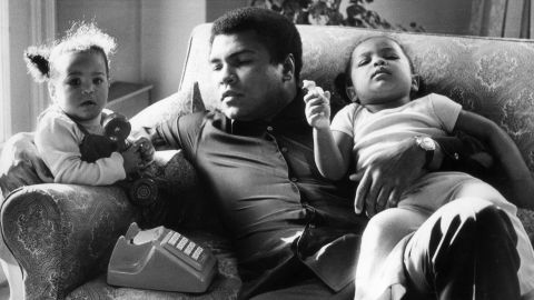 Ali sits with his daughters Laila and Hana at the Grosvenor House in London in December 1978. He briefly retired from professional boxing the following year.