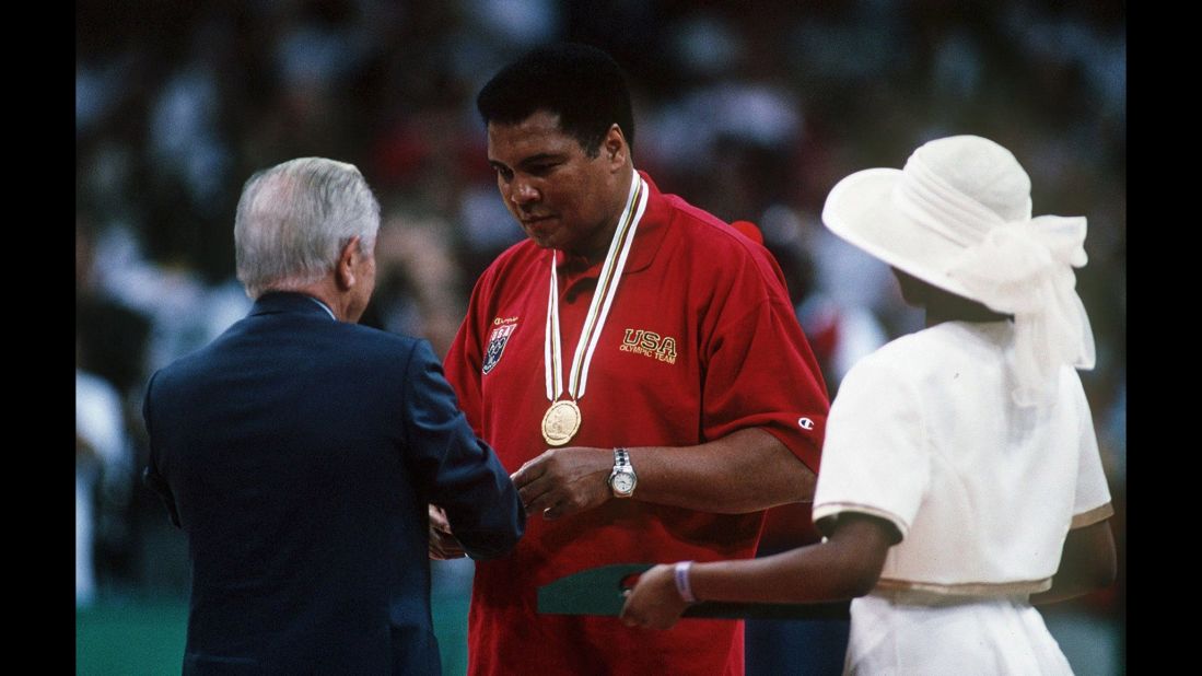 Juan Antonio Samaranch, president of the International Olympic Committee, gives Ali a replacement gold medal in 1996. Ali had thrown his 1960 gold medal into the Ohio River after he was criticized for not fighting in Vietnam.