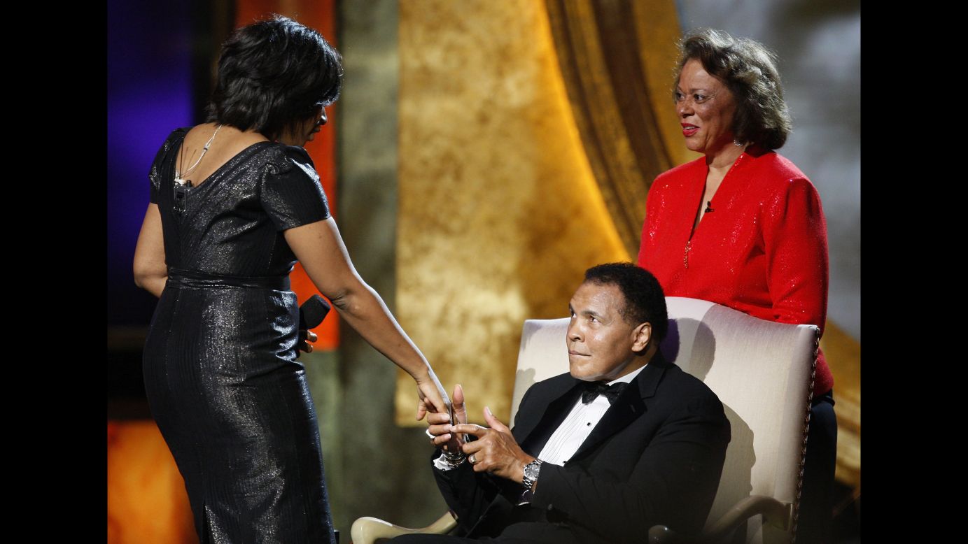 Ali's wife, Lonnie, watches as actress Alfre Woodard presents him with the President's Award during the 2009 NAACP Image Awards in Los Angeles.