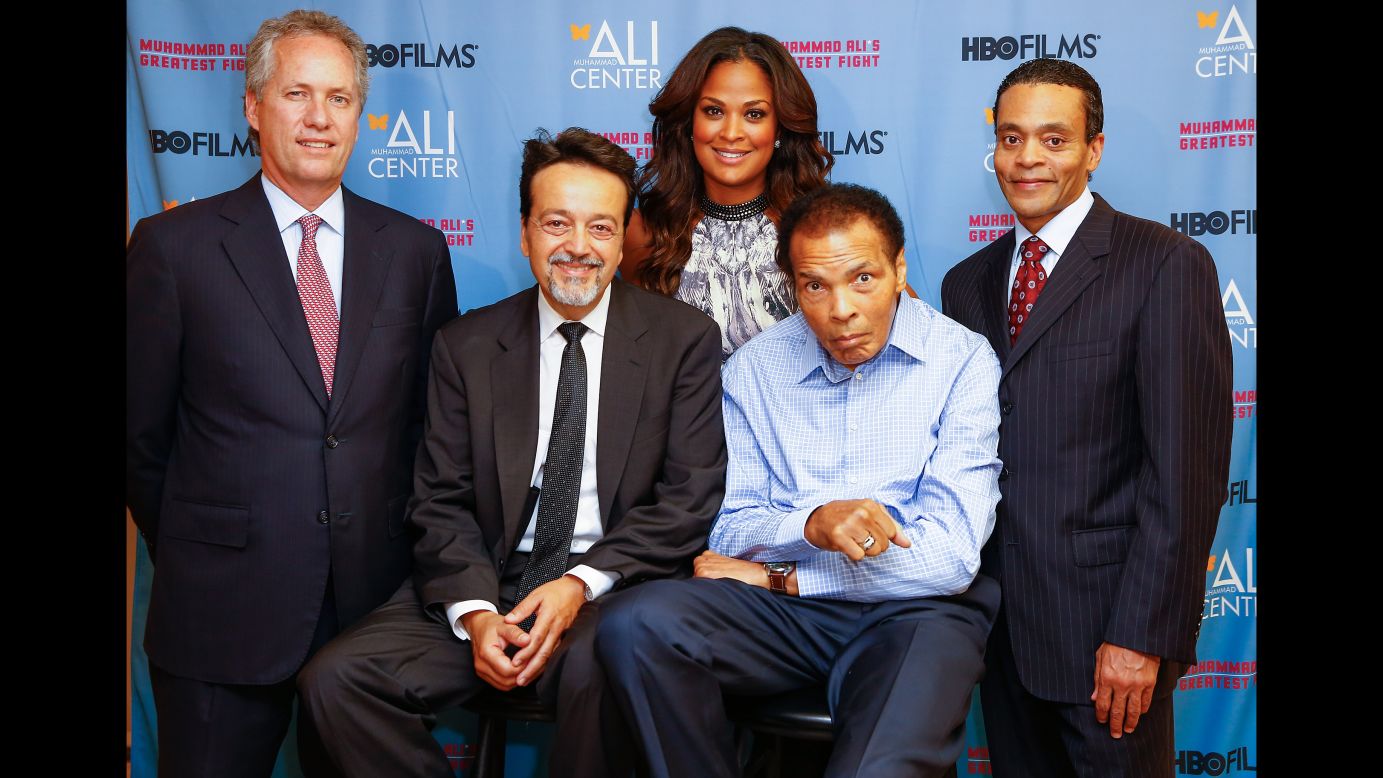 Ali poses for a picture with, from left, Greg Fischer, Len Amato, daughter Laila Ali and Donald Lassere during the U.S. premiere of the HBO film "Muhammad Ali's Greatest Fight" in October 2013.