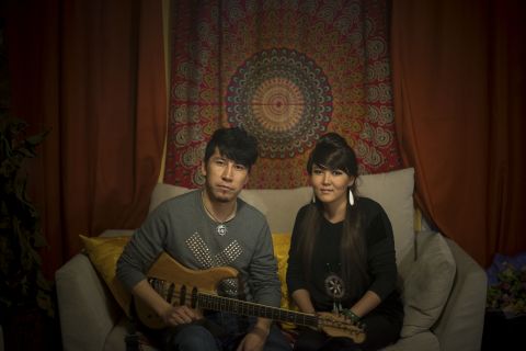 I'm Bayirta, and here's my wife Bayin. We're Mongolians from Xinjiang. I'm 30. I used to be guitarist and composer for a band and we won a national award in 2011. I just got married with Bayin this year, she was our back-up vocalist. We're preparing to set up our own band this year. 