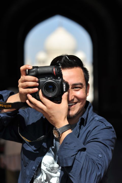 Kurbanjan Samat, 32, is a cameraman and photographer. He started a project called "I'm from Xinjiang" last December to take portraits of people from Xinjiang now living in other places. He's publishing a book of 100 stories selected from more than 500 people he spoke to.