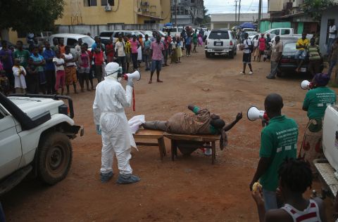 Aid workers from the Liberian Medical Renaissance League stage an Ebola awareness event on Wednesday, October 15, in Monrovia, Liberia. The group performs street dramas throughout Monrovia to educate the public on Ebola symptoms and how to handle people who are infected with the virus.