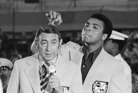 Ali toys with the finely combed hair of television sports commentator Howard Cosell before the start of the Olympic boxing trials in August 1972.