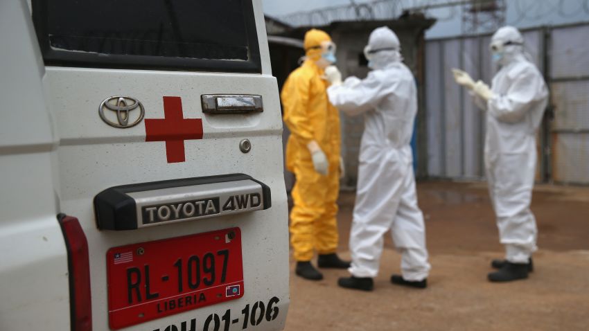Caption:MONROVIA, LIBERIA - OCTOBER 13: Health workers dress in protective clothing before taking the body of an Ebola victim from the Island Clinic Ebola treatment center on October 13, 2014 in Monrovia, Liberia. A planned strike at Ebola treatment centers was averted as most nurses and health care workers reported for work, many saying they could not in good conscience leave their patients unattended. Health workers have been asking for increased hazard pay. They are one of the most high-risk groups of Ebola infection, as nearly 100 of them have died in Liberia alone. (Photo byCaption:MONROVIA, LIBERIA - OCTOBER 13: Health workers dress in protective clothing before taking the body of an Ebola victim from the Island Clinic Ebola treatment center on October 13, 2014 in Monrovia, Liberia. A planned strike at Ebola treatment centers was averted as most nurses and health care workers reported for work, many saying they could not in good conscience leave their patients unattended. Health workers have been asking for increased hazard pay. They are one of the most high-risk groups of Ebola infection, as nearly 100 of them have died in Liberia alone. (Photo by John Moore/Getty Images)
)