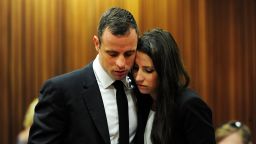 Oscar Pistorius with his sister Aimee on the thirteenth day of his trial for the murder of his girlfriend Reeva Steenkamp at the North Gauteng High Court in Pretoria on March 19, 2014.