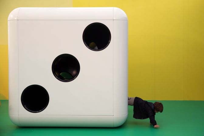 It was the beginning of a week of the bold, the beautiful, and the downright bonkers. Here, a child climbs out of a huge dice, part of an installation by artist Carsten Holler titled "Gartenkinder".