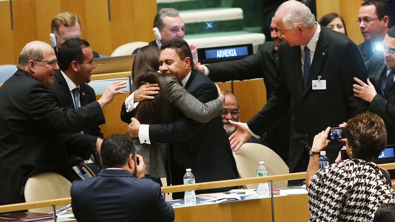 NEW YORK, NY - OCTOBER 16: UN representatives for Venezuela, including Foreign Minister Rafael Ramrez (R) celebrate after being elected to a two year term as a non-permanent member of the United Nations Security Council following secret voting at the United Nations General Assembly on October 16, 2014 in New York City. Malaysia, Venezuela and Angola were running unopposed for their three regional seats while the other two seats are for the Western Europe and Others group with the candidates being Turkey, Spain and New Zealand. The Security Council has 15 members, five of which are permanent and 10 non-permanent. The 10 non permanent members of the council are elected on a regional basis and serve two-year terms. (Photo by Spencer Platt/Getty Images)