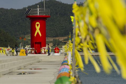 Jindo harbor, where the search operation is based, has become a memorial for those who lost their lives. Yellow ribbons and photos are displayed as people come to pay their respects.