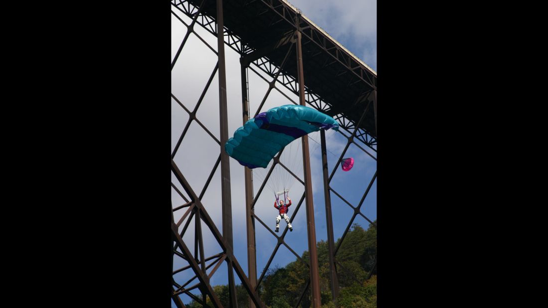 About 80,000 spectators attended the Bridge Day festival in 2013 to watch the jumpers leap off the bridge and sail to the earth below. 