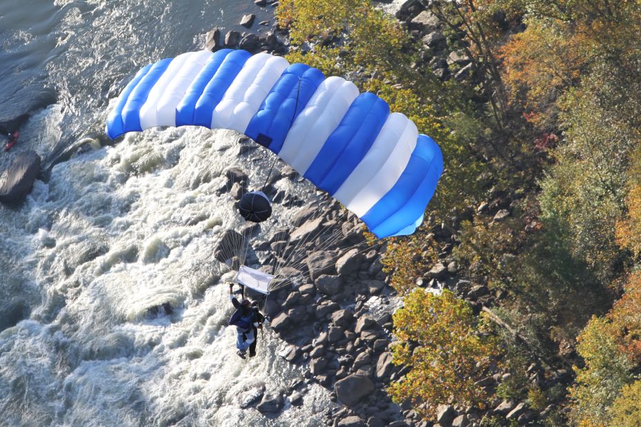 A tandem BASE jump at Bridge Day allows an inexperienced passenger to be attached to an experienced BASE jumper. 