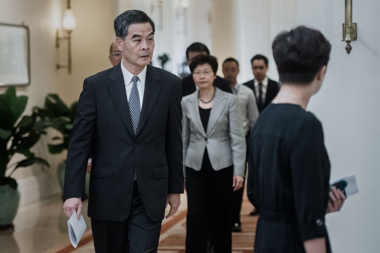 Hong Kong Chief Executive C.Y. Leung arrives for a news conference on October 16. He said talks would resume with students as early as next week, but he said street protests had caused severe disruption and could not continue.
