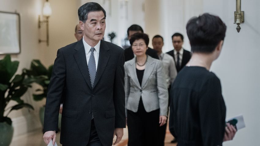 Hong Kong Chief Executive Leung Chun-ying walks down a corridor before a press conference in Hong Kong on October 16, 2014. Hong Kong's embattled leader made a dramatic u-turn reopening his offer of talks with student protesters a week after the government abruptly pulled out of discussions aimed at ending more than a fortnight of mass democracy rallies.
