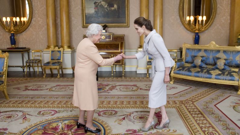 Actress Angelina Jolie, right, is <a href="http://www.cnn.com/2014/10/10/showbiz/britain-angelina-jolie/">presented with an honorary damehood</a> by Britain's Queen Elizabeth II on Friday, October 10, at London's Buckingham Palace. Jolie was recognized for her campaign to end sexual violence in war zones. <a href="http://www.cnn.com/2013/05/14/showbiz/gallery/angelina-jolie/index.html">See more photos of Jolie's life and career</a>