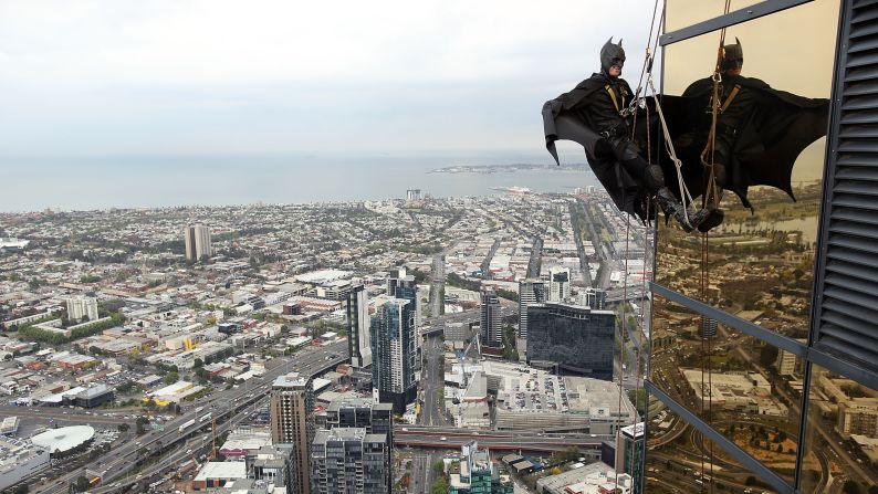 Stuntman Chris Davies, dressed as Batman, scales Melbourne's Eureka Tower on Wednesday, October 15.
