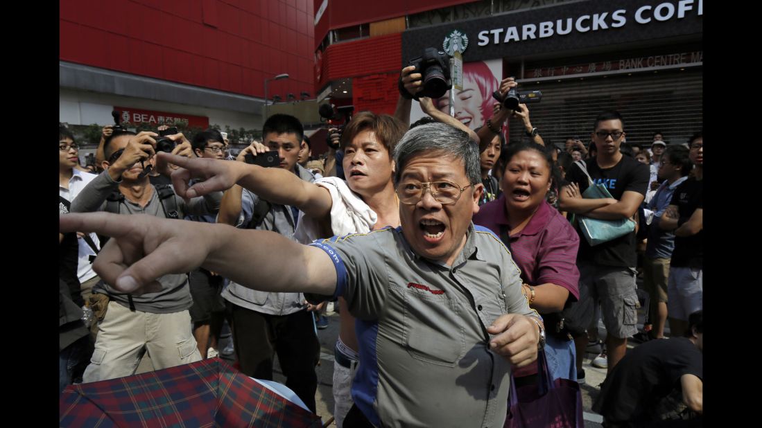 People shout at pro-democracy protesters on October 17. 