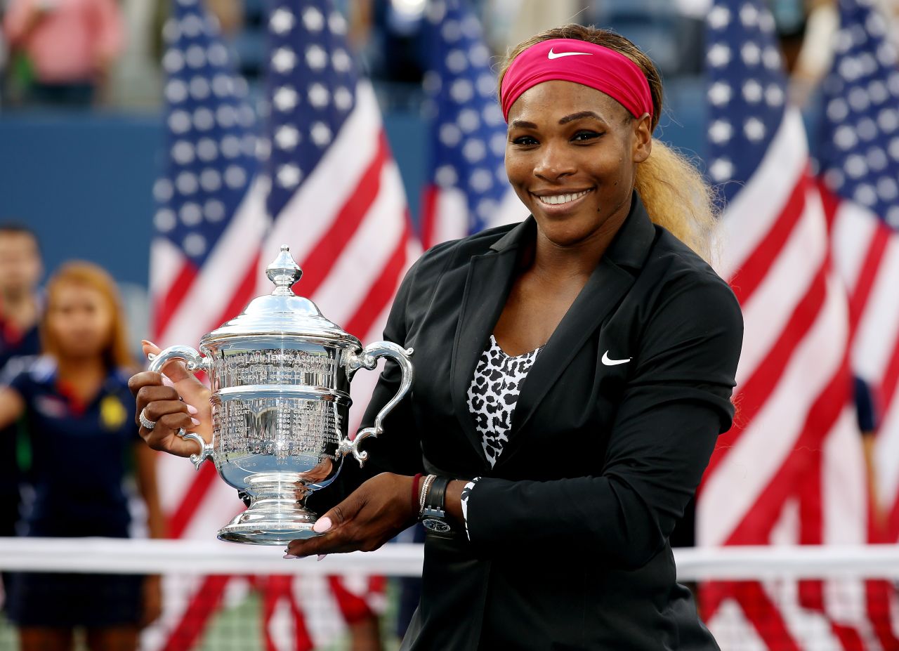 A more formally-attired Serena celebrates one of her six victories at the U.S. Open.