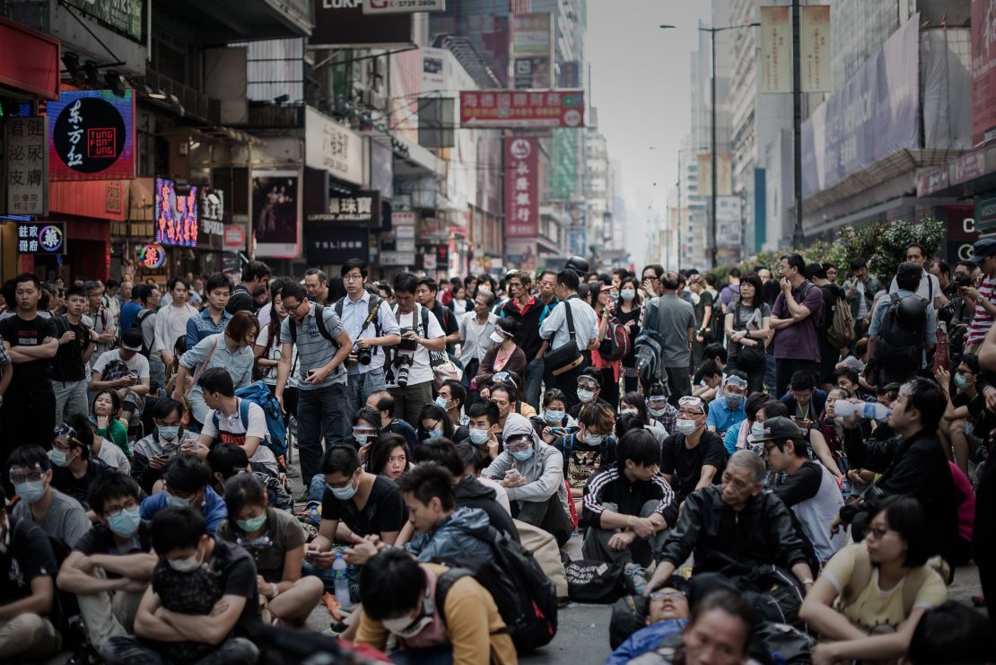 Pro-democracy protesters stand their ground in the financial district of Hong Kong on October 17, 2014.