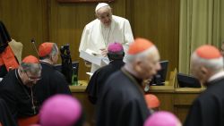 Pope Francis talks to prelates as he arrives at the morning session of a two-week synod on family issues at the Vatican, Saturday, October 18.