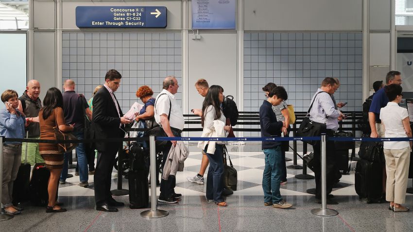 CHICAGO, IL - SEPTEMBER 24: Passengers wait in line to go through security screening at O'Hare International Airport's Terminal 1 shortly after the terminal was reopened on September 24, 2014 in Chicago, Illinois. The ticketing and baggage claim areas of the terminal were evacuated for nearly two hours after a after an unattended bag was discovered around 9:30 this morning. (Photo by Scott Olson/Getty Images)