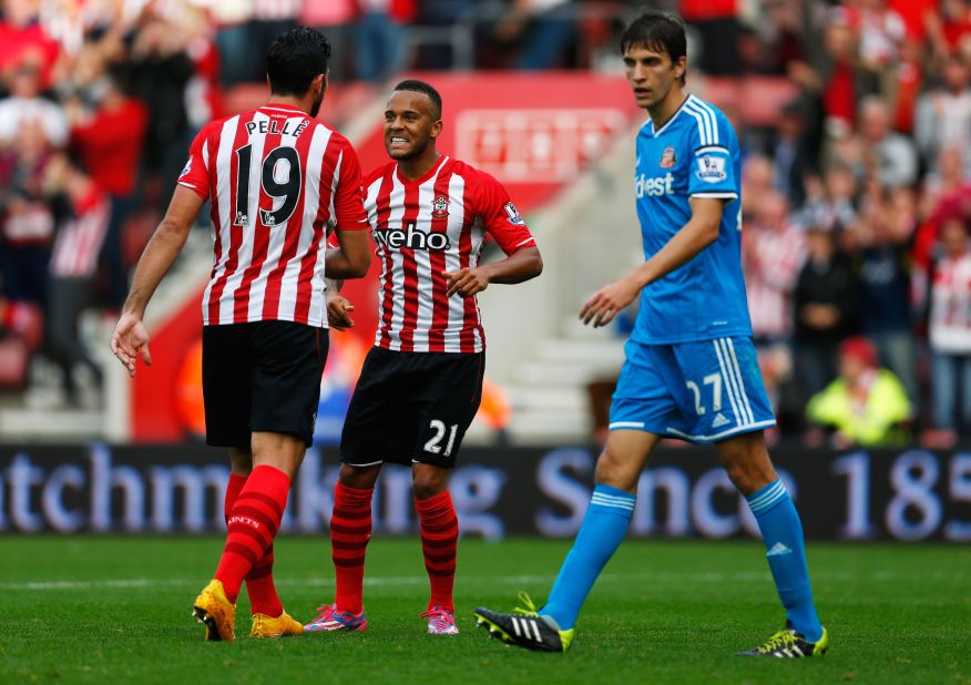 Santiago Vergini cuts a forlorn figure as Southampton celebrates a goal in the 8-0 rout of Sunderland at St Mary's.