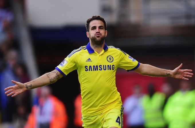 Cesc Fabregas celebrates his second half strike for Chelsea in a 2-1 win over Crystal Palace to stay top of the EPL.