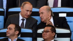 Russian President Vladimir Putin (L) and FIFA President Joseph Blatter attend the 2014 FIFA World Cup final football match between Germany and Argentina at the Maracana Stadium in Rio de Janeiro, Brazil, on July 13, 2014. AFP PHOTO / PEDRO UGARTE (Photo credit should read PEDRO UGARTE/AFP/Getty Images)