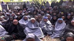 A screengrab taken on May 12, 2014, from a video of Nigerian Islamist extremist group Boko Haram obtained by AFP shows girls, wearing the full-length hijab and praying in an undisclosed rural location. Boko Haram released a new video on claiming to show the missing Nigerian s