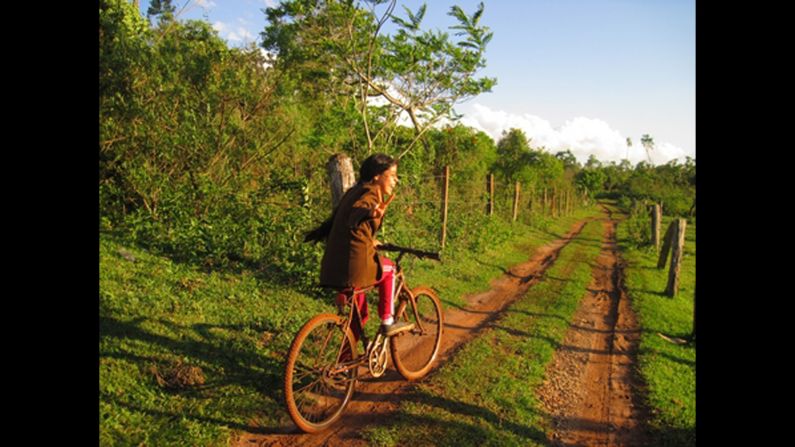 Former Peace Corps volunteer <a href="http://ireport.cnn.com/docs/DOC-555478">Kristin McCarthy </a>captured this photo while she was in Paraguay from 2010 to 2012. On the bike is a girl named<strong> </strong>Ruth, then an eighth-grader.