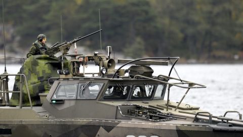 A member of the Swedish military mans a gun on a fast-attack craft on Saturday, October 18.