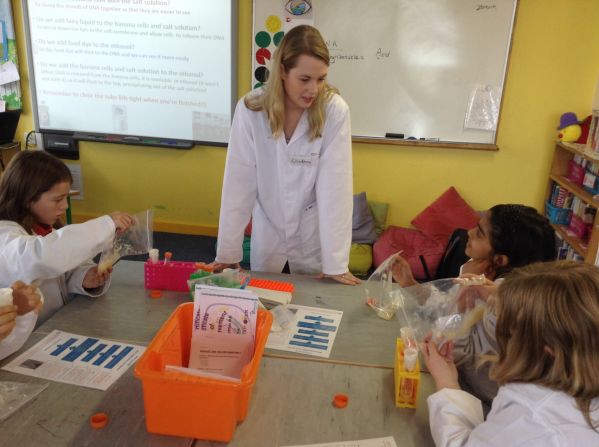 Girls in a primary school in Galway, Ireland learn from a member of the<a href="index.php?page=&url=http%3A%2F%2Fwww.cellexplorers.com%2F" target="_blank" target="_blank"> Cell EXPLORERS</a>, a science education and outreach program based in the School of Natural Sciences in the National University of Ireland. From a pilot project involving 10 of Biochemistry lecturer Muriel Grenon's undergraduate students, the program has successfully grown to 100 volunteers reaching about 3000 members of the public.  <br />"Our aim is to promote hands-on discovery of molecular and cellular biology by developing interactive outreach activities," says Grenon. "Such activities include school roadshows and science festival workshops. We aim to inspire and engage young people in biomedical sciences and provide role models of real people studying science."