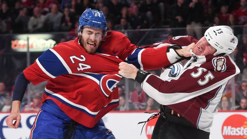 Montreal's Jarred Tinordi, left, fights Colorado's Cody McLeod during an NHL game Saturday, October 18, in Montreal, Quebec.