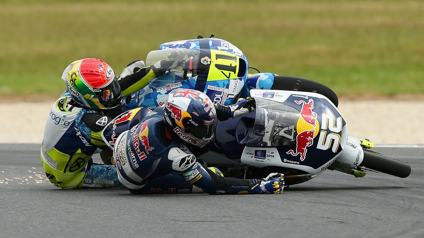 Brad Binder, left, and Danny Kent crash during the Moto3 race in Phillip Island, Australia, on Sunday, October 19. Both Binder and Kent were able to recover and finish the race.