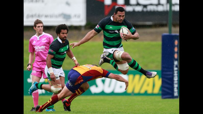 South Canterbury's Josateki Veikune jumps over the attempted tackle of North Otago's Robbie Smith during a Lochore Cup semifinal match Saturday, October 18, in Timaru, New Zealand. North Otago won 16-12 to advance to the final against Steelform Wanganui.