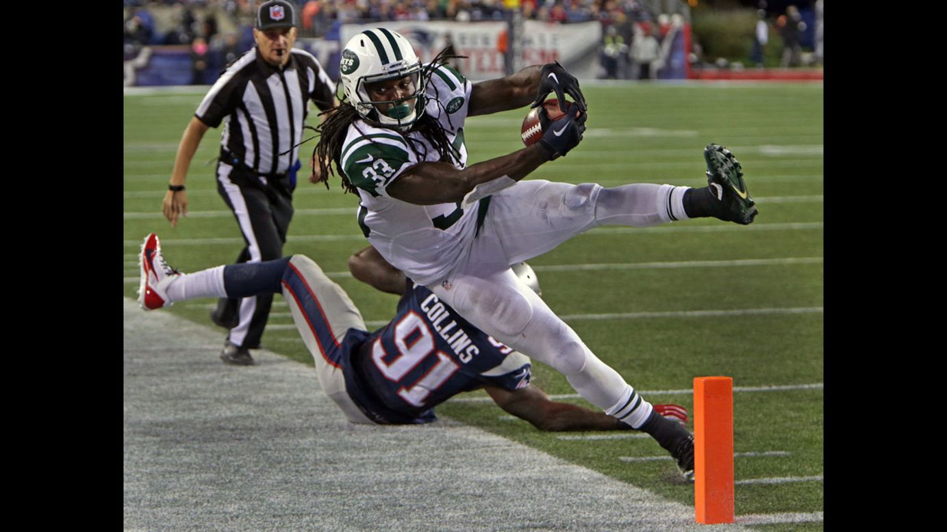 New York Jets running back Chris Ivory tries to lunge for the goal line as he is knocked out of bounds by New England Patriots linebacker Jamie Collins on Thursday, October 16. The Patriots defeated the Jets 27-25.