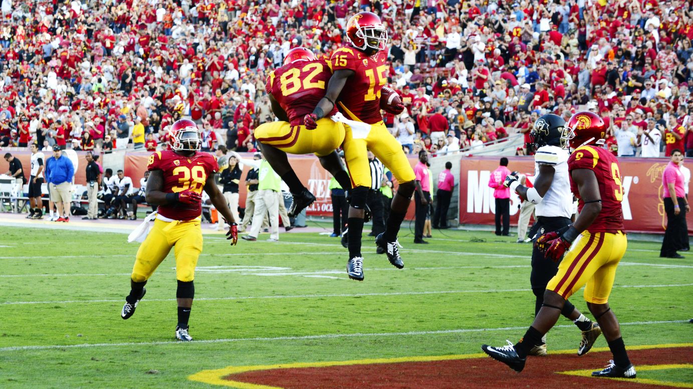 USC's Nelson Agholor (No. 15) celebrates with a teammate after scoring a touchdown during the Trojans' 56-28 victory over Colorado on Saturday, October 18.