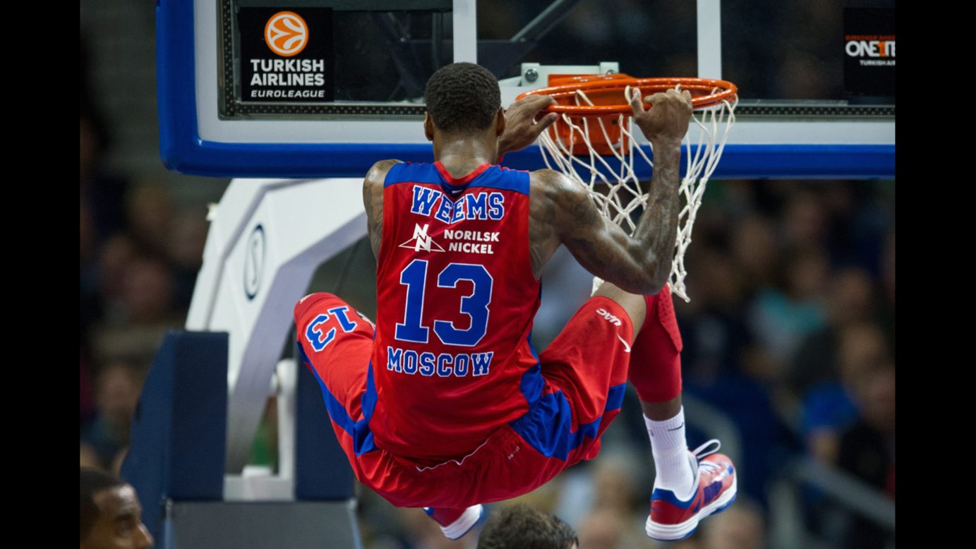 Sonny Weems of CSKA Moscow hangs on the rim after dunking during a Euroleague game in Berlin on Friday, October 17.