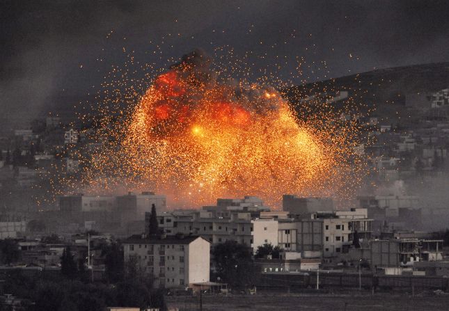 An explosion rocks Kobani, Syria, during a reported car bomb attack by ISIS militants on Tuesday, October 20.