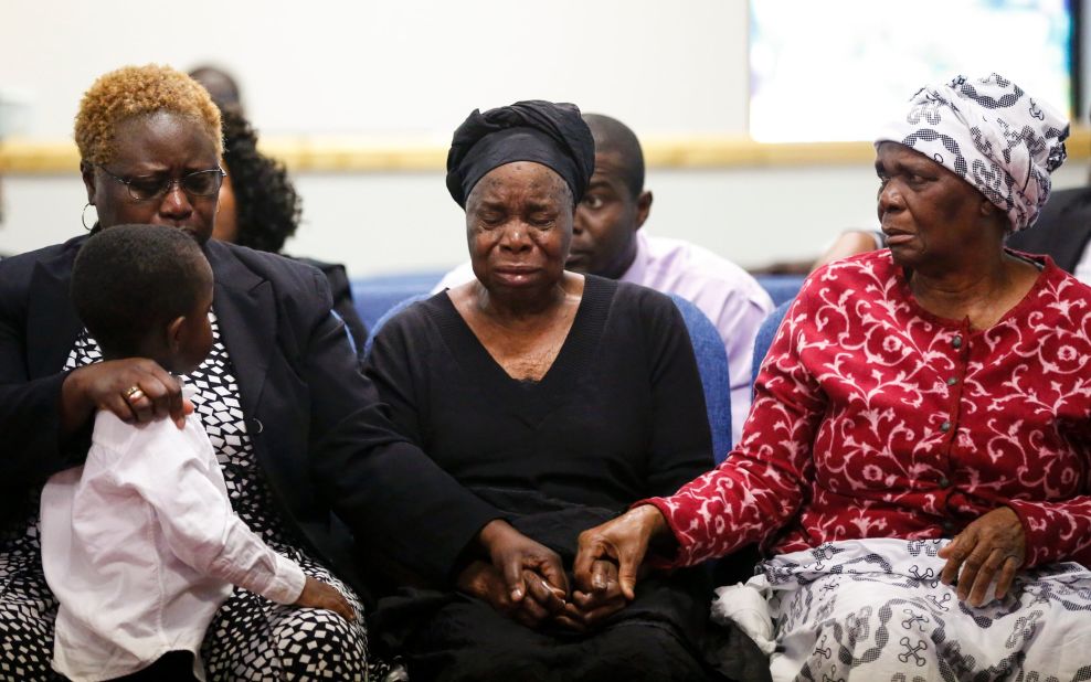 Garteh Korkoryah, center, is comforted during a memorial service for her son, Thomas Eric Duncan, on October 18, 2014, in Salisbury, North Carolina. Duncan, a 42-year-old Liberian citizen, died October 8 in a Dallas hospital. He was in the country to visit his son and his son's mother, and he was the first person in the United States to be diagnosed with Ebola.