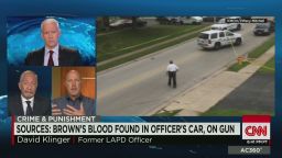Sources: Brown's blood on cop's car, uniform