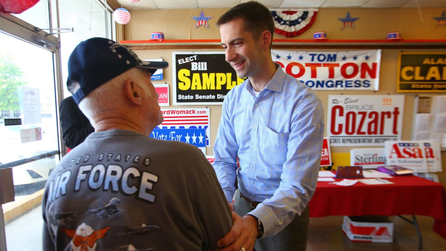 U.S. Rep. Tom Cotton , right, greets George Edwards, left, after Cotton addressed a crowd of supporters at a Republican headquarters office  April 26, 2014 in Hot Springs, Ark.