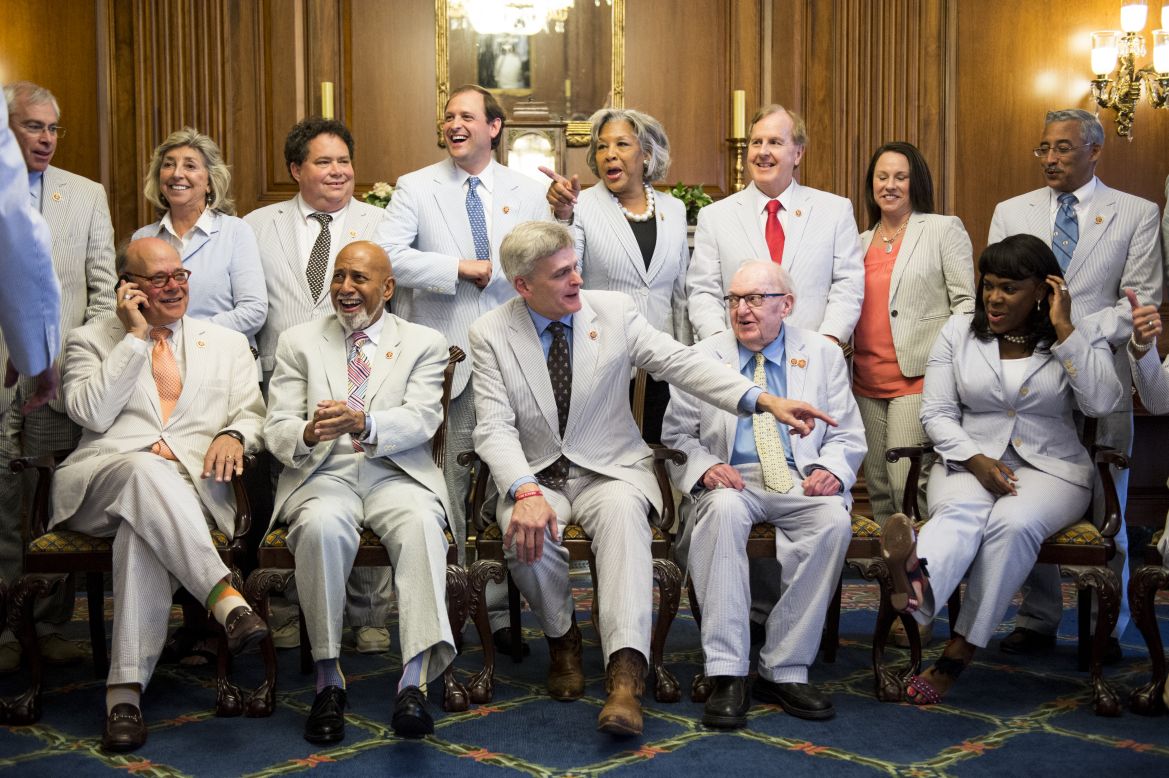 Cassidy, center, admires the seersucker outfits of his fellow Congress members on June 11.
