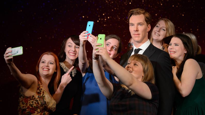 Women take selfies around a wax figure of actor Benedict Cumberbatch after it was unveiled at Madame Tussauds in London on Tuesday, October 21.