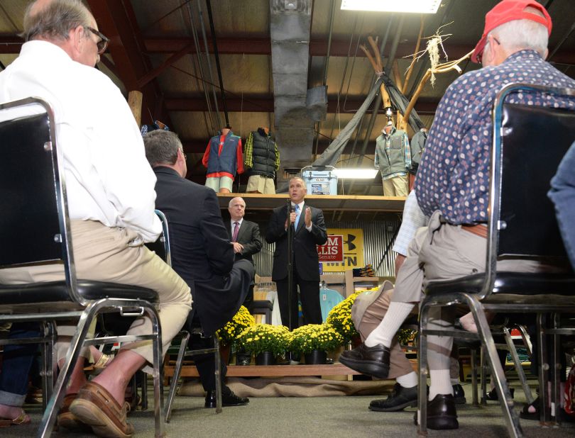 Tillis, flanked by U.S. Sen. John McCain, speaks at Neuse Sport Shop during a campaign stop in Kinston last month.